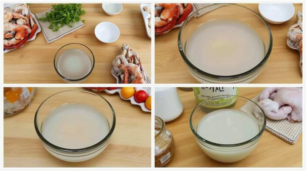 Fish maw soaking in a glass bowl with fresh ingredients on a wooden countertop.