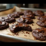 Freshly baked chocolate brownie cookies on tray